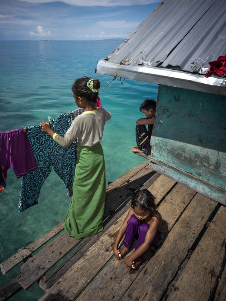 Stilt Home Children by Chan Kim — canvas wall art