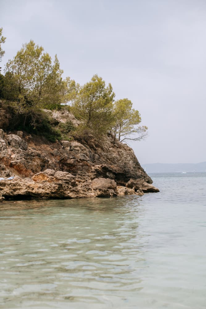Clear Waters Rocky Shore by Claudia Casal — canvas wall art