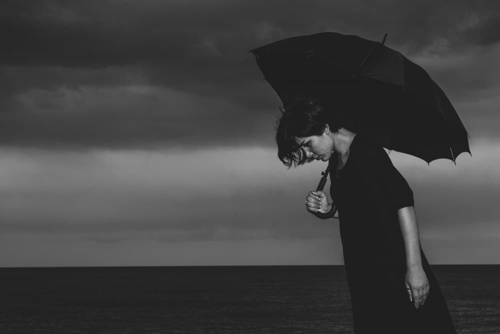 Pensive Woman Umbrella by engin akyurt — canvas wall art