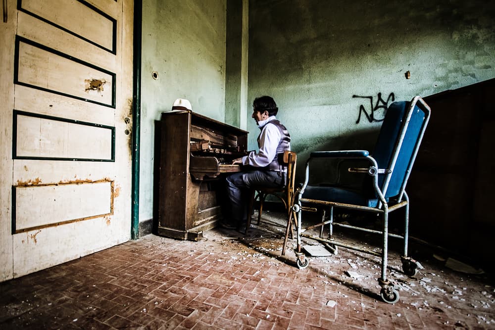 Abandoned Piano Man by Daraio Domenico — canvas wall art