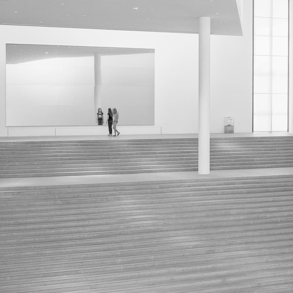 Women on Museum Stairs by Michael M. — canvas wall art