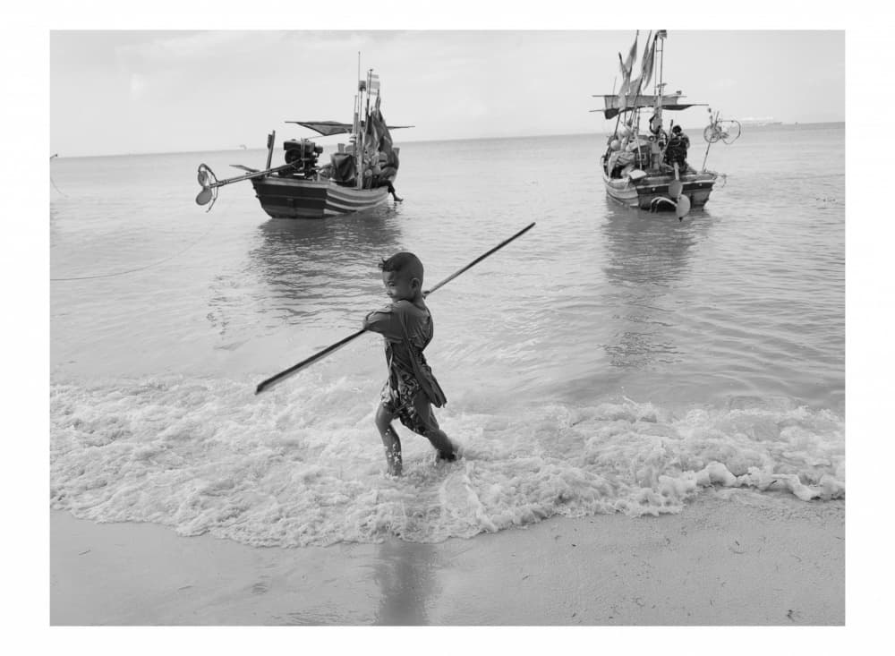 Boy Playing by Boats by Thabiet Kamaldien — canvas wall art