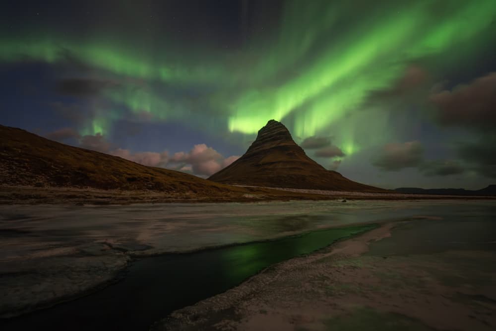 Green Aurora Over Kirkjufell by Yongnan Li （李永男） — canvas wall art