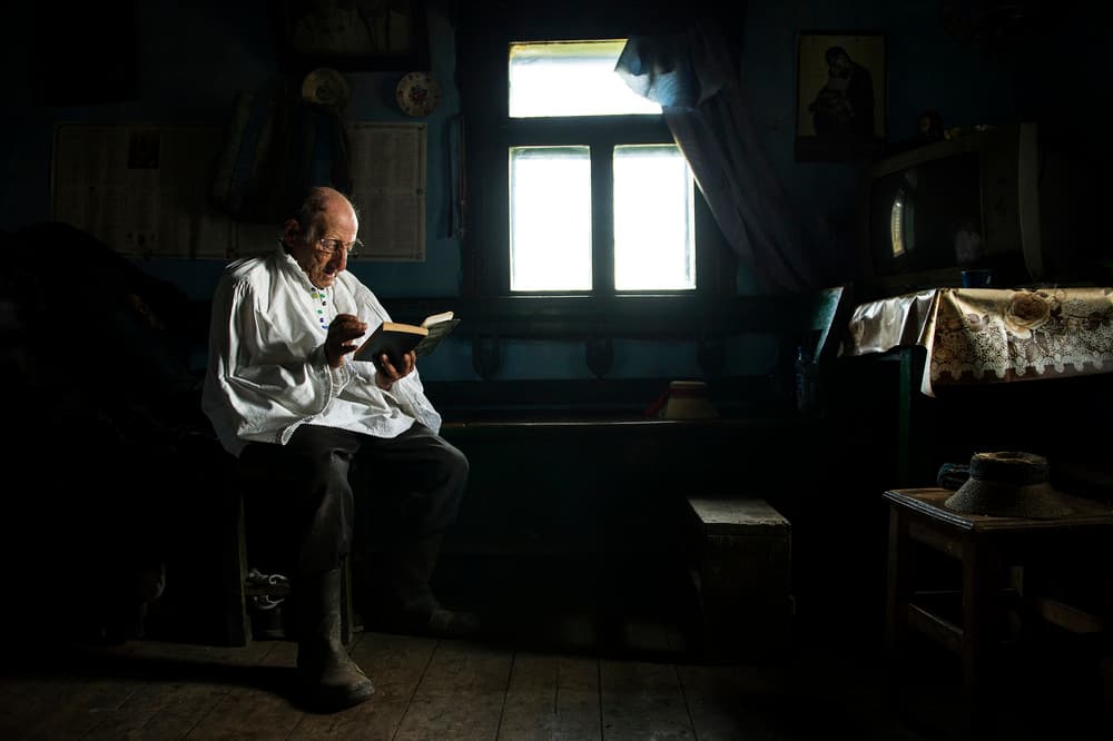 Old Man Reading Quietly by Vlad Dumitrescu — canvas wall art