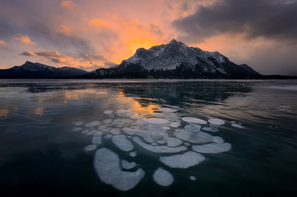 Frozen Lake Mountain Sunset by Lydia Jacobs — canvas wall art