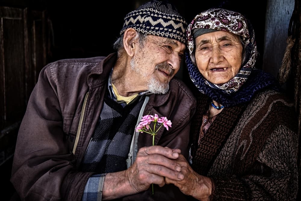 Loving Elderly Couple by Seyhan Terzioglu — canvas wall art