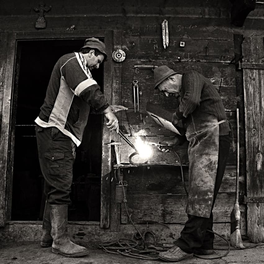 Blacksmiths Forging Metal by Vlad Dumitrescu — canvas wall art