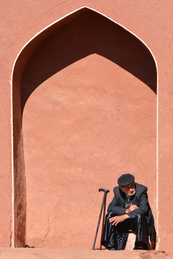 Elderly Man Red Archway by Moein Hosseini — canvas wall art