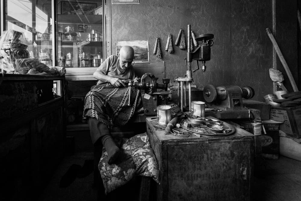 Focused Craftsman at Work by Moein Hosseini — canvas wall art