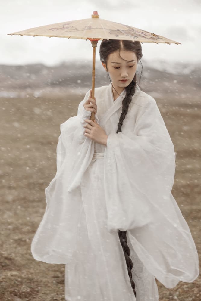 Woman With Umbrella In Snow by 吴子诚WuZiCheng — canvas wall art