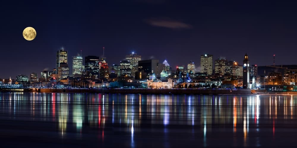 Moonlit City Reflections by YuppiDu — canvas wall art