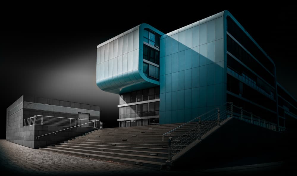 Sleek Blue Building by Jörg  Vollrath — canvas wall art