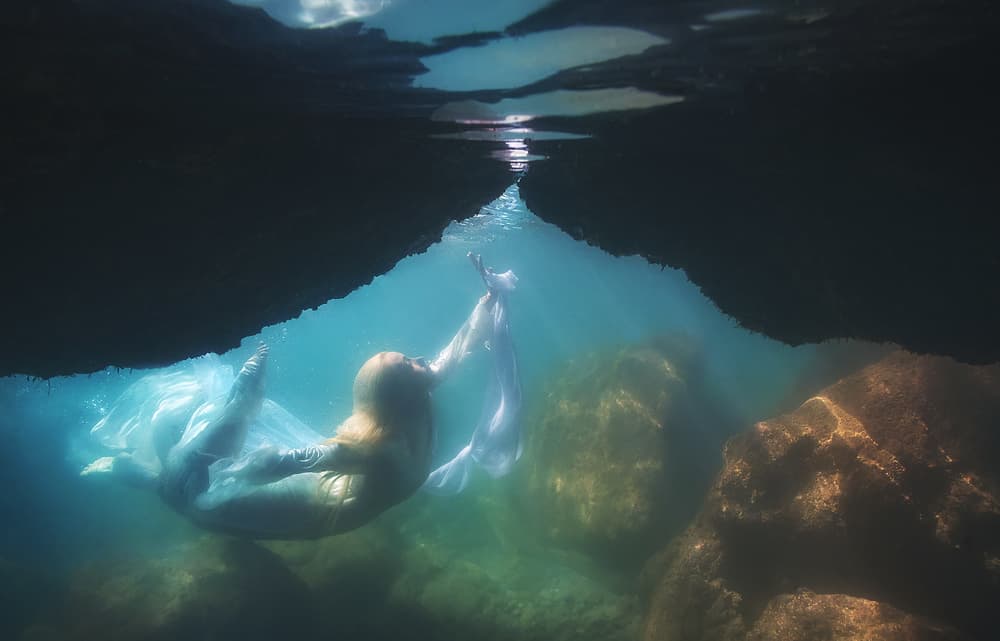 Floating Woman Underwater Cave by Paolo Lazzarotti — canvas wall art
