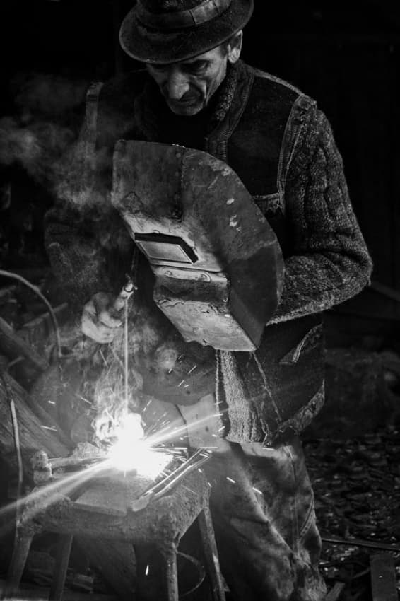 Man Welding Sparks by Vlad Dumitrescu — canvas wall art