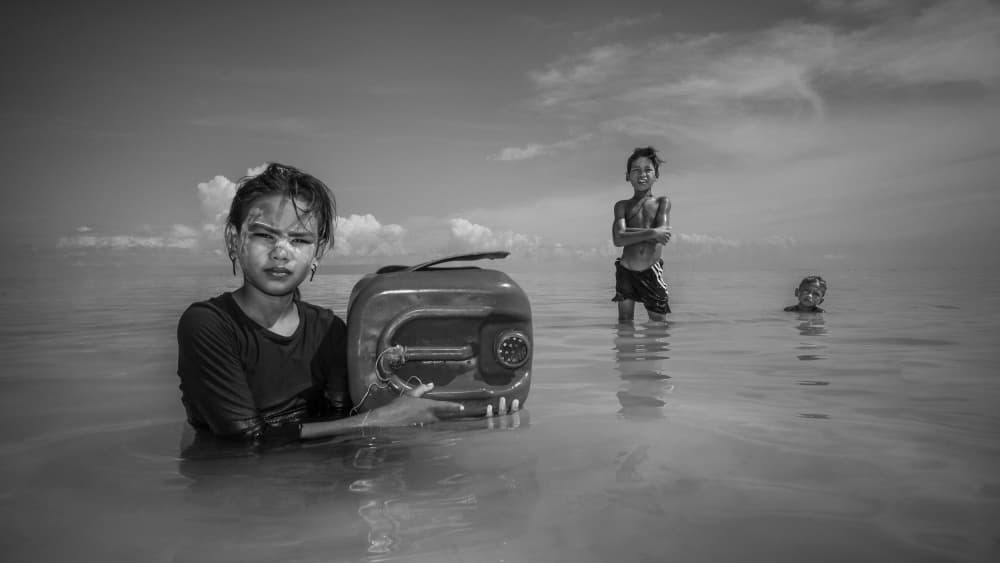 Young Girl Carrying Water by Chan Kim — canvas wall art