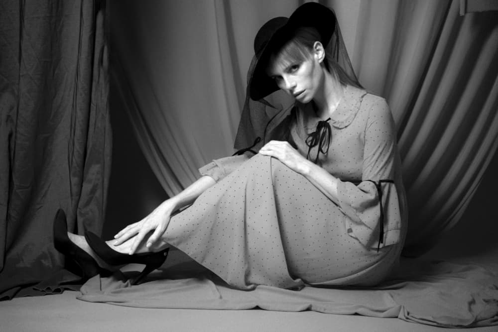 Elegant Woman Black Hat by Shuki Laufer — canvas wall art