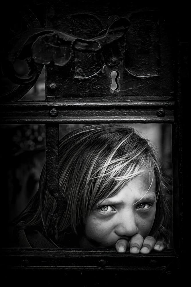 Child Behind the Gate by Danna Sladjana — canvas wall art