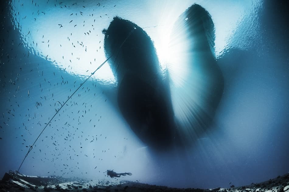 Diver Under Sunlit Boat by Csaba Tokolyi — canvas wall art