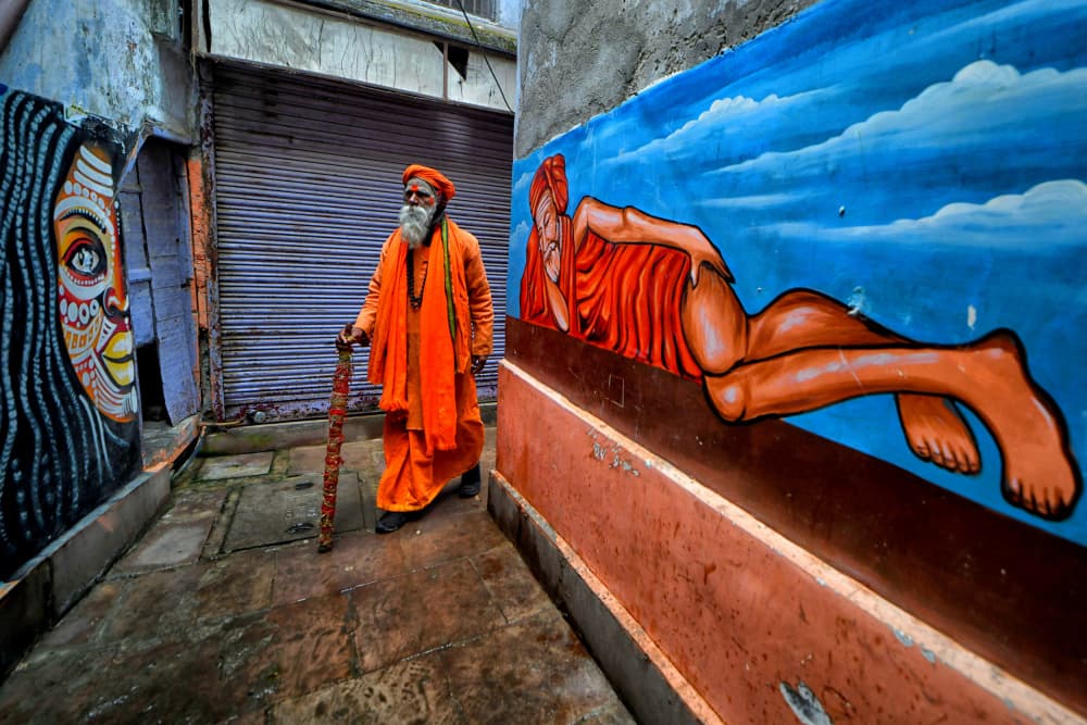Sadhu Amidst Murals by Avishek Das — canvas wall art