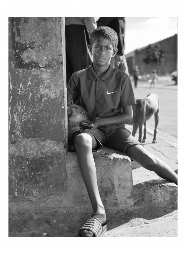 Street Boy and Dog by Thabiet Kamaldien — canvas wall art