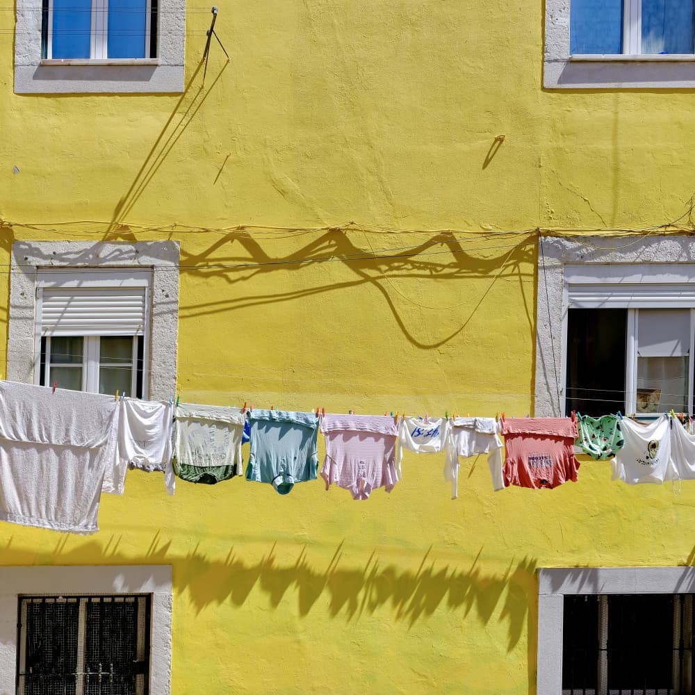 Yellow Wall Laundry by Rob Darby — canvas wall art