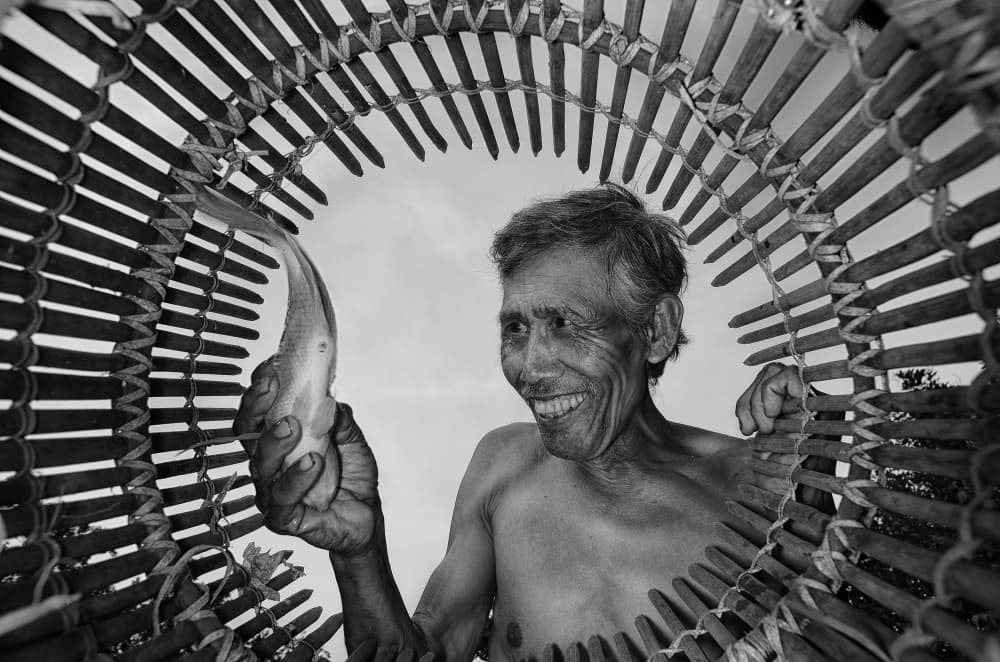 Smiling Fisherman's Catch by Girdan Nasution — canvas wall art