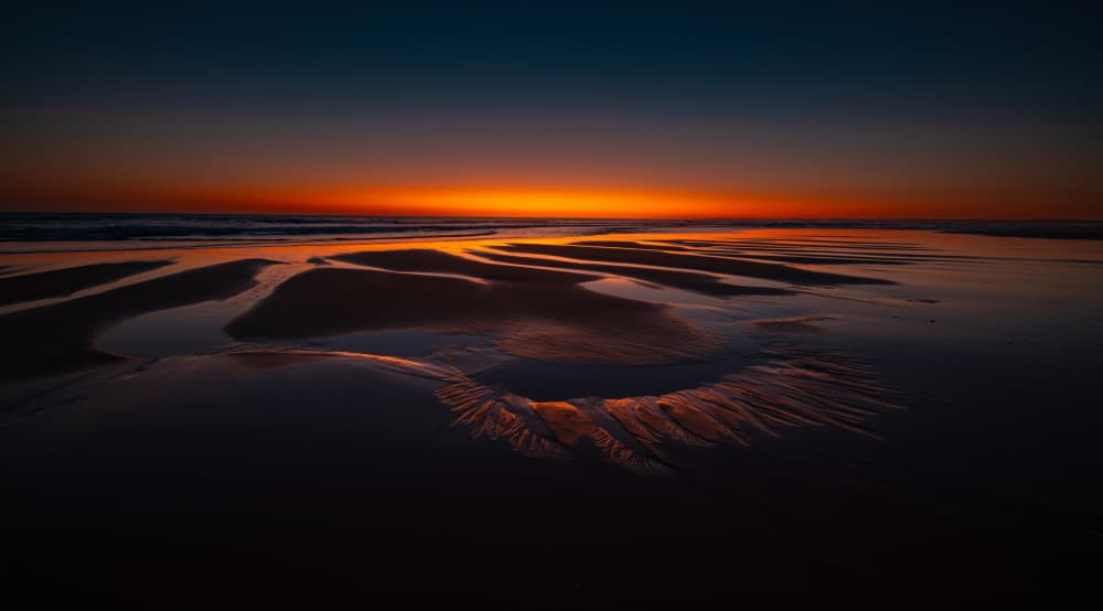Vibrant Sunset Tidal Patterns by Zhaonian Zhou — canvas wall art