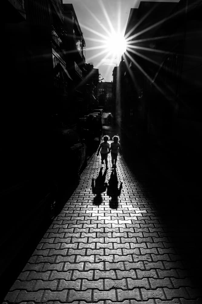 Kids on Sunlit Path by Yasemin Bakan — canvas wall art
