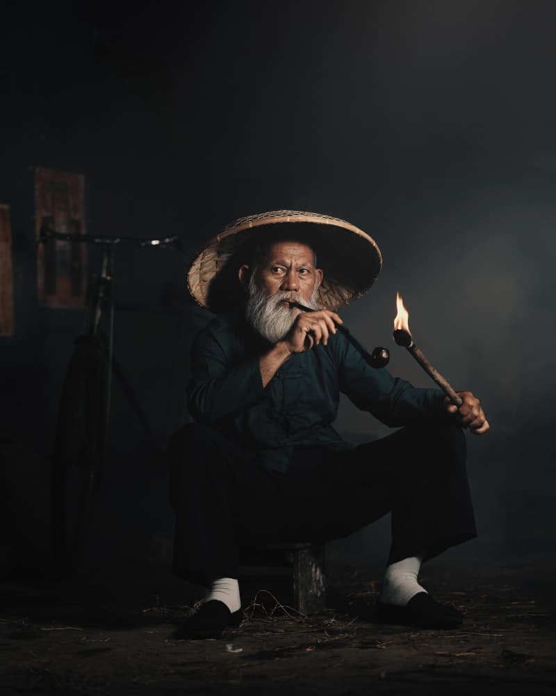 Wise Elder Smoking Pipe by Asep Awaludin — canvas wall art